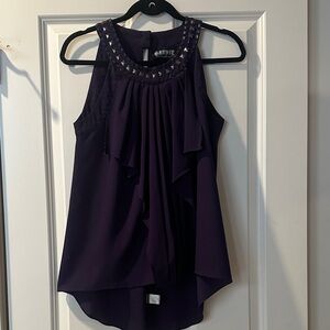 Chic Sleeveless Blouse with Embellished Neckline